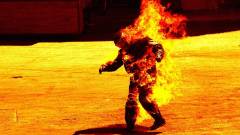 людина горить